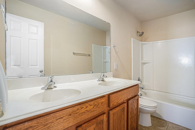 full bathroom with vanity, tub / shower combination, tile patterned floors, and toilet