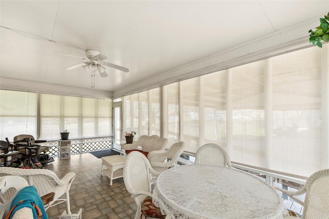 sunroom / solarium with ceiling fan