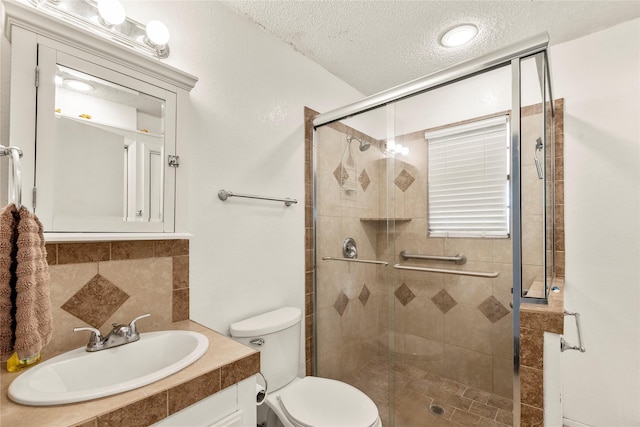 bathroom featuring sink, backsplash, walk in shower, toilet, and a textured ceiling