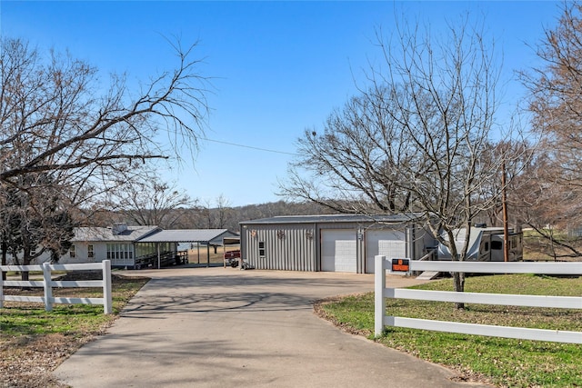 exterior space featuring a garage and an outdoor structure