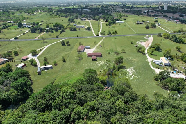 birds eye view of property with a rural view and a water view