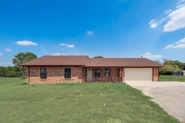 ranch-style home featuring a garage, a front lawn, and a porch