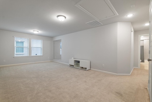 unfurnished room featuring light colored carpet