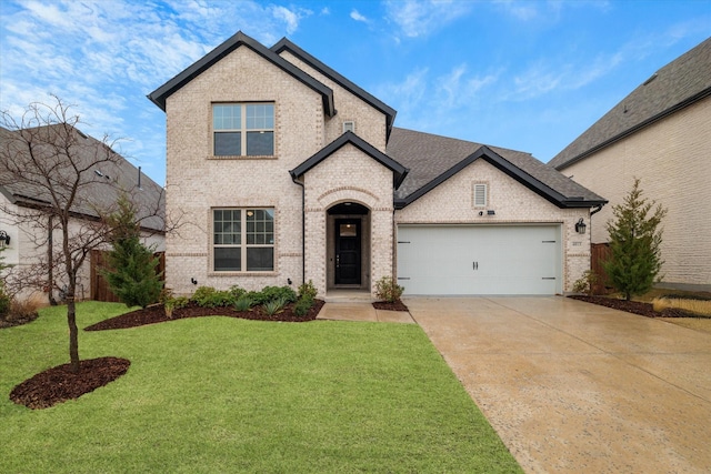 french country inspired facade featuring a garage and a front yard