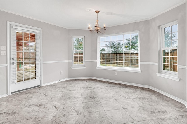 unfurnished room featuring a chandelier and ornamental molding