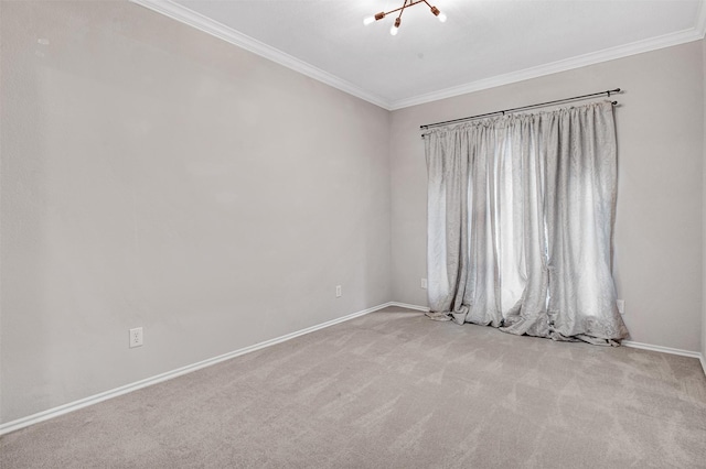 carpeted empty room with ornamental molding and an inviting chandelier