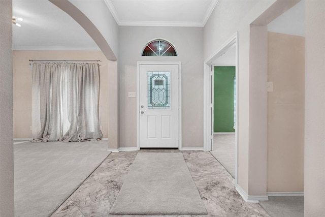 824 Rolling Meadow Dr, Lavon, TX 75166 - entryway featuring arched walkways, marble look tile flooring, ornamental molding, baseboards, and carpet