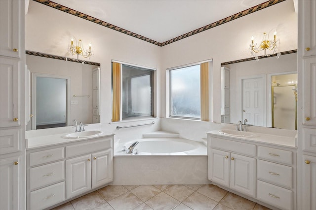 bathroom featuring vanity, shower with separate bathtub, and tile patterned flooring