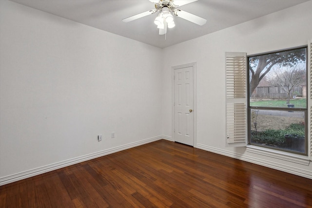 unfurnished room with ceiling fan, a healthy amount of sunlight, and dark hardwood / wood-style flooring