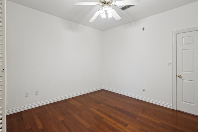 empty room featuring dark hardwood / wood-style floors and ceiling fan