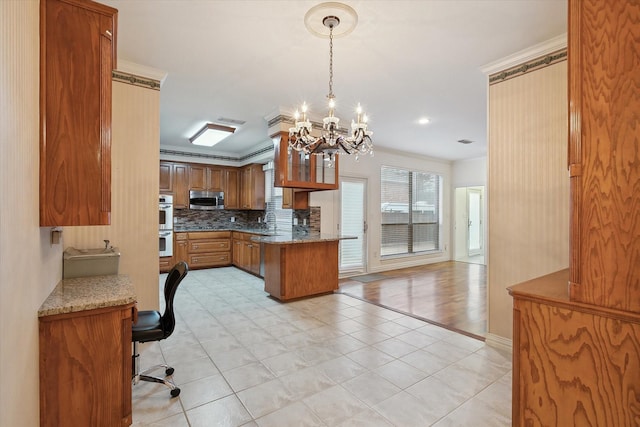 kitchen featuring a breakfast bar area, tasteful backsplash, ornamental molding, kitchen peninsula, and stainless steel appliances