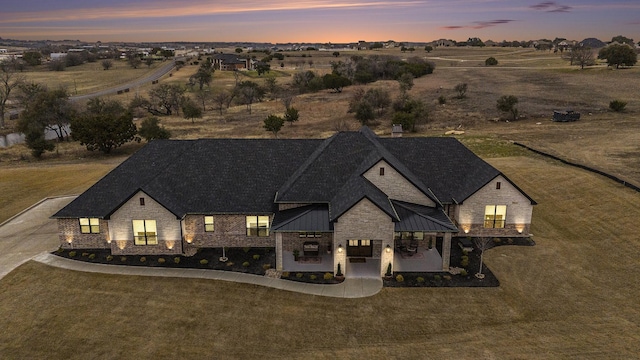 view of front of property with a yard