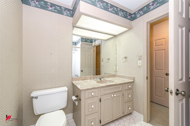 bathroom featuring vanity, tile patterned floors, and toilet