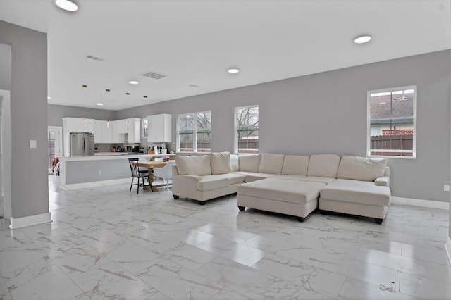 living room featuring marble finish floor, visible vents, baseboards, and recessed lighting