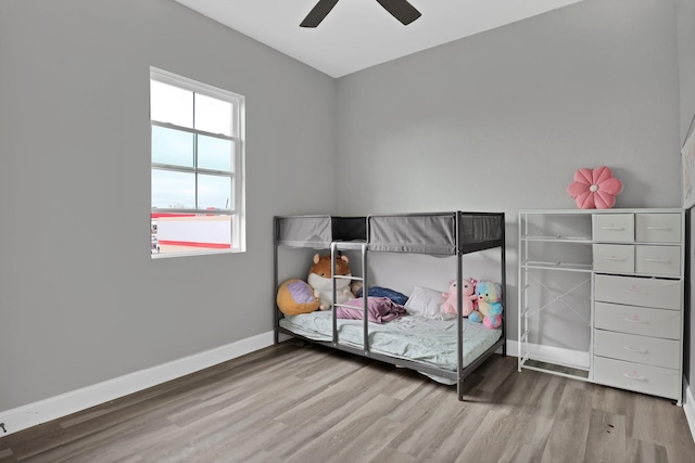 bedroom featuring hardwood / wood-style flooring and ceiling fan