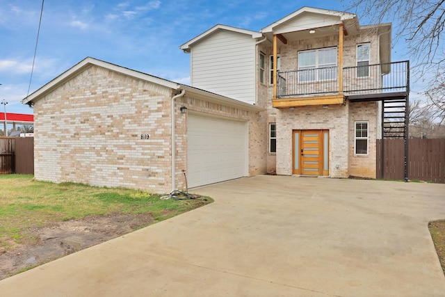 view of front facade featuring driveway, stairway, an attached garage, fence, and brick siding