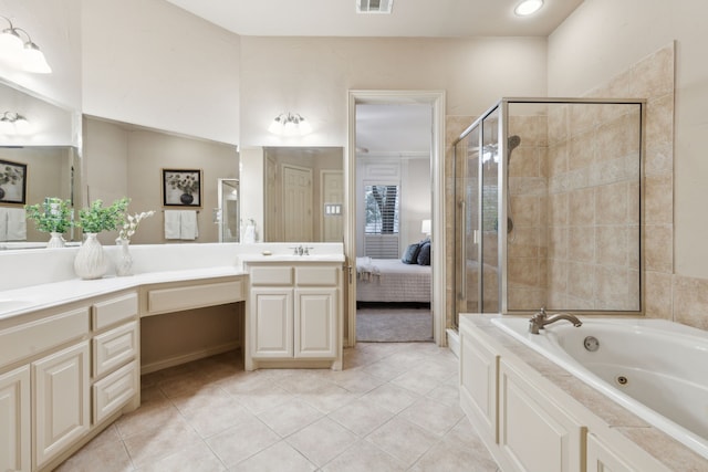 bathroom with tile patterned flooring, vanity, and separate shower and tub