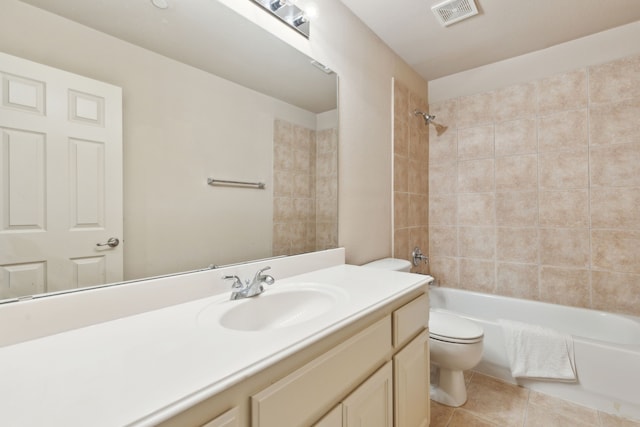 full bathroom with vanity, tiled shower / bath, tile patterned floors, and toilet