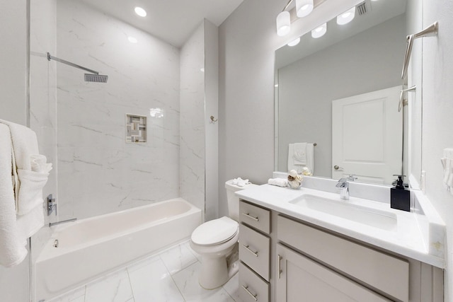 full bathroom with tiled shower / bath combo, vanity, and toilet