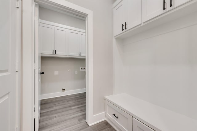 mudroom with wood-type flooring