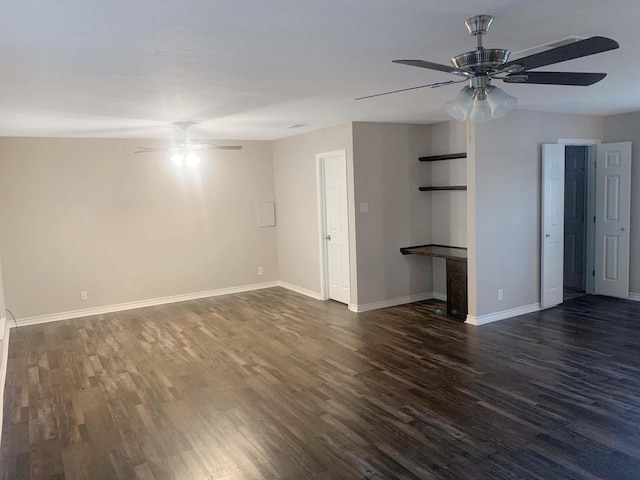 unfurnished living room with dark wood-type flooring and ceiling fan