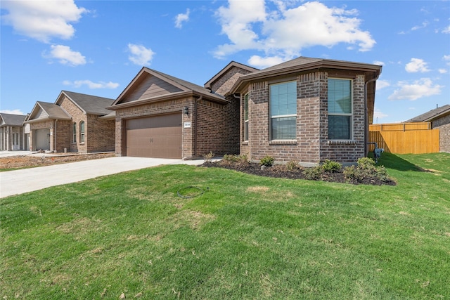 view of front of home featuring a garage and a front lawn