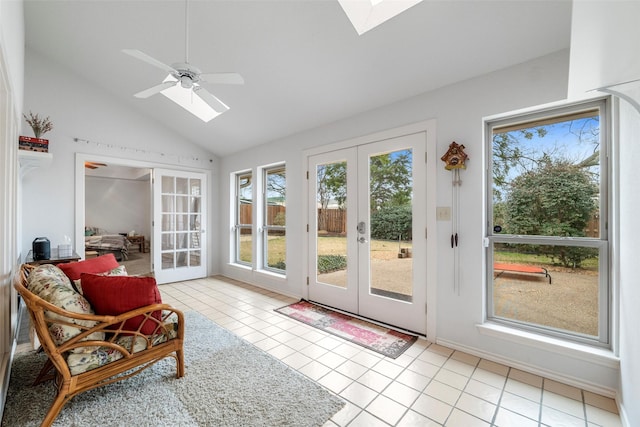 sunroom featuring french doors, ceiling fan, lofted ceiling with skylight, and a wealth of natural light