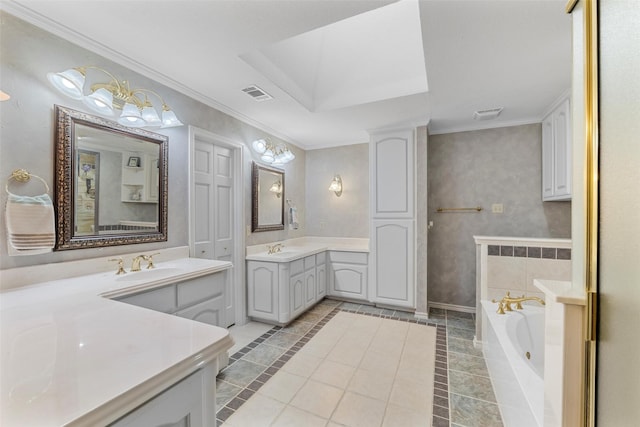 bathroom with crown molding, vanity, a bath, and tile patterned flooring