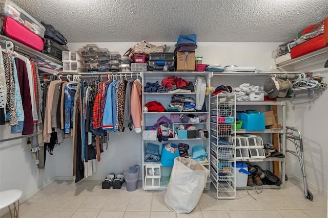 spacious closet featuring tile patterned floors