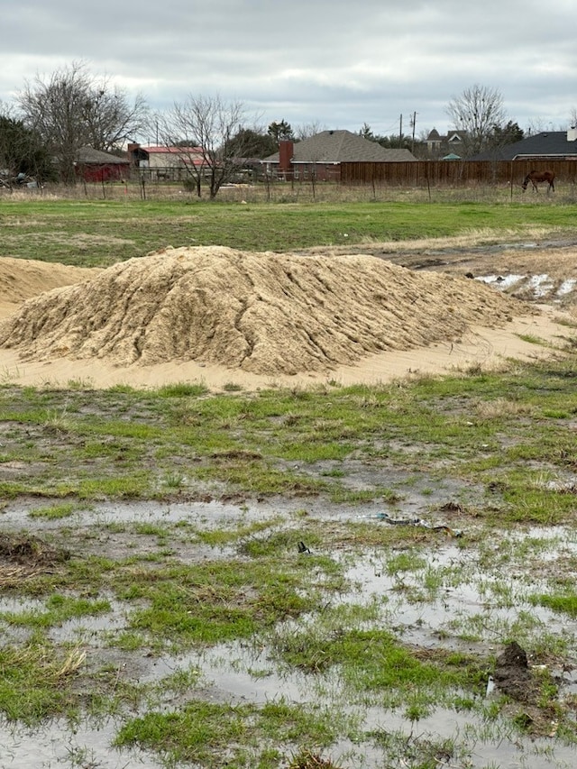 view of yard with a rural view