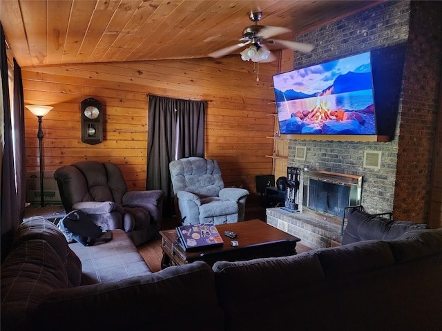 3929 San Saba St, Athens, TX 75752 - living area featuring a ceiling fan, lofted ceiling, a brick fireplace, wood walls, and wood finished floors