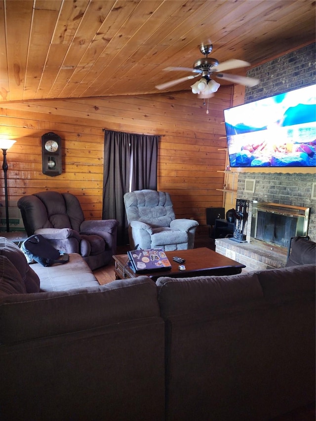 3929 San Saba St, Athens, TX 75752 - living room with a ceiling fan, a brick fireplace, wood ceiling, and wood walls