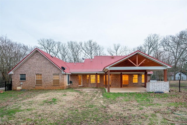 rear view of house with a patio