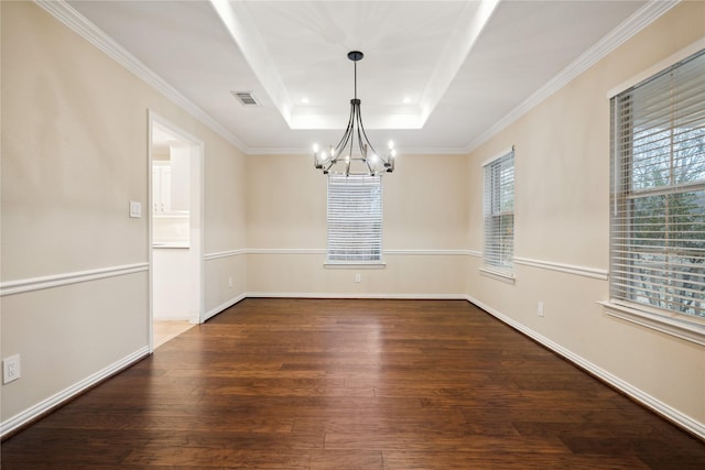 unfurnished dining area with crown molding, a notable chandelier, dark hardwood / wood-style floors, and a raised ceiling