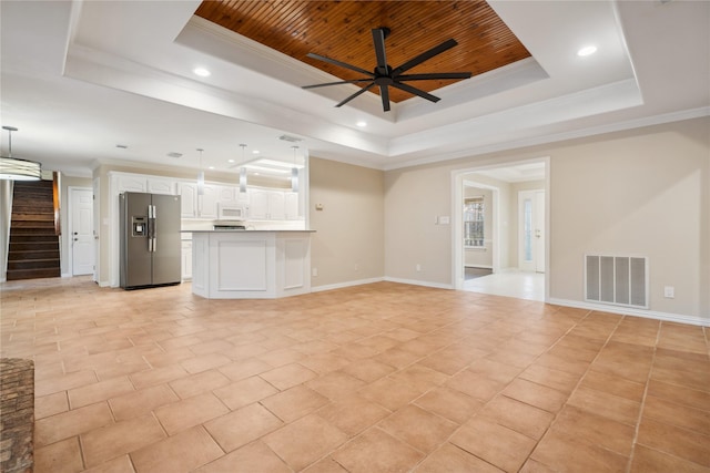 unfurnished living room with a raised ceiling, ornamental molding, ceiling fan, and wood ceiling