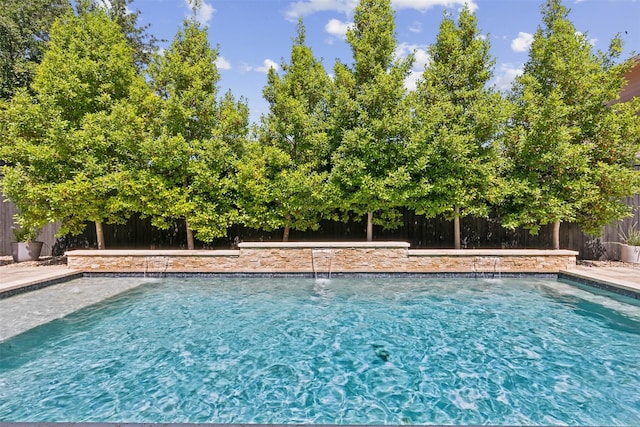 view of swimming pool featuring a fenced backyard and a fenced in pool