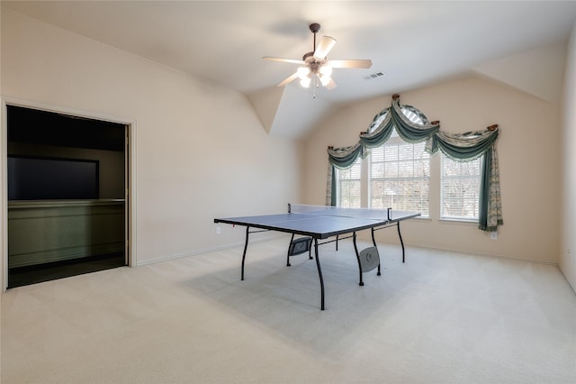 game room featuring visible vents, a ceiling fan, light carpet, vaulted ceiling, and baseboards