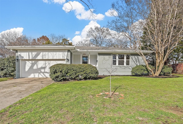 single story home featuring a garage and a front yard