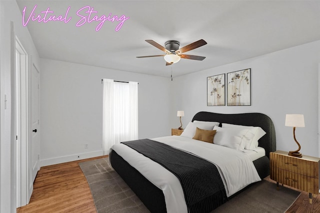 bedroom with ceiling fan and wood-type flooring