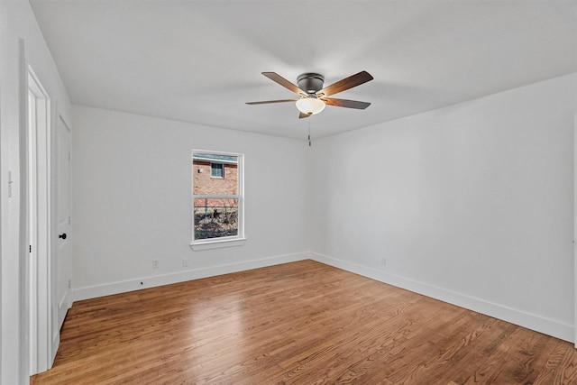 unfurnished room with ceiling fan and light hardwood / wood-style floors