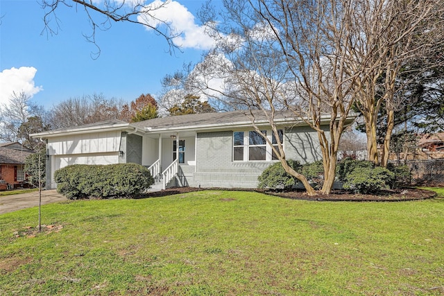 view of front of property with a garage and a front lawn