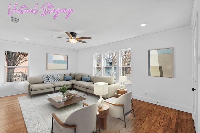 living room featuring crown molding, ceiling fan, and hardwood / wood-style floors