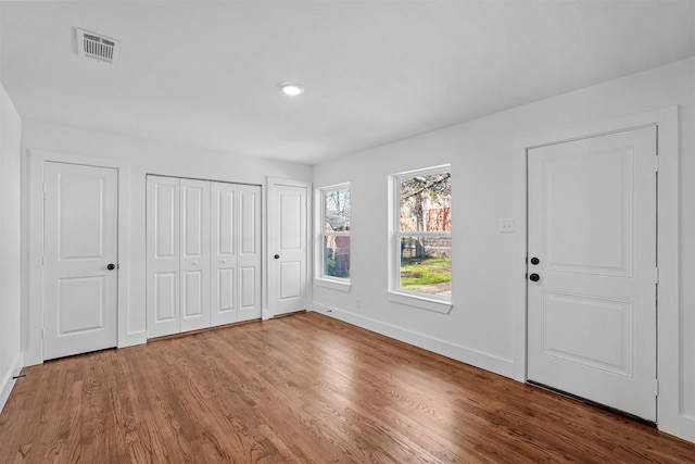 unfurnished bedroom featuring hardwood / wood-style floors