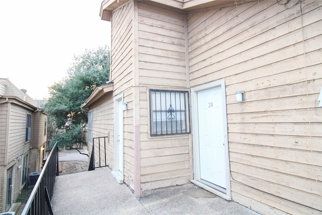 doorway to property featuring central AC unit