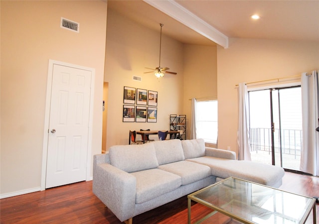 living room with high vaulted ceiling, dark hardwood / wood-style floors, and ceiling fan