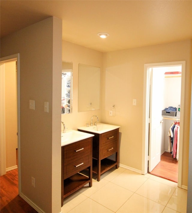 bathroom featuring tile patterned flooring and vanity