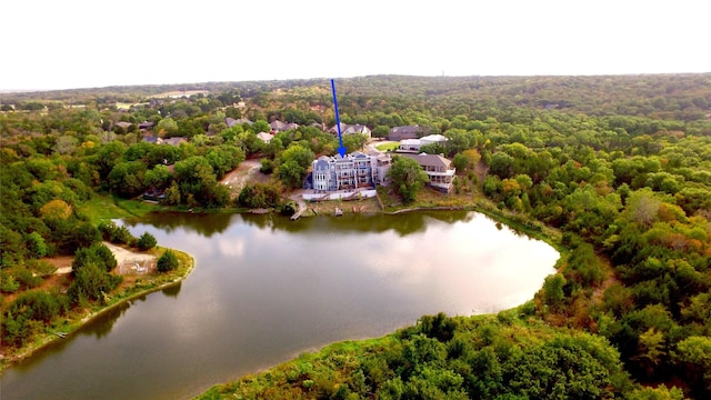 drone / aerial view featuring a water view and a view of trees