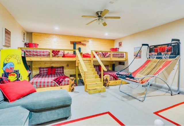 bedroom featuring wooden walls