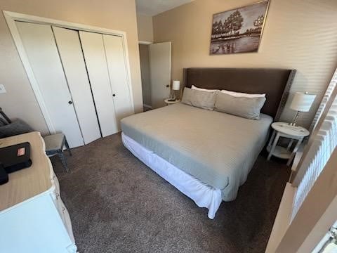 bedroom with carpet and a closet