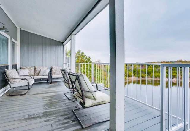 balcony featuring a water view